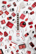 White JHS Relevator electric guitar surrounded by red and white effect pedals on a white background